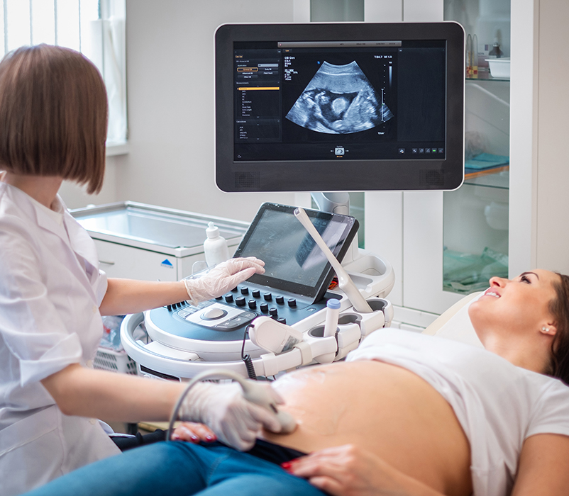 Pregnant woman on utltrasonographic examination at hospital